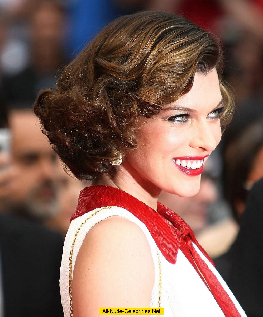 Milla Jovovich posing for paparazzi at Cannes Film Festival 2011