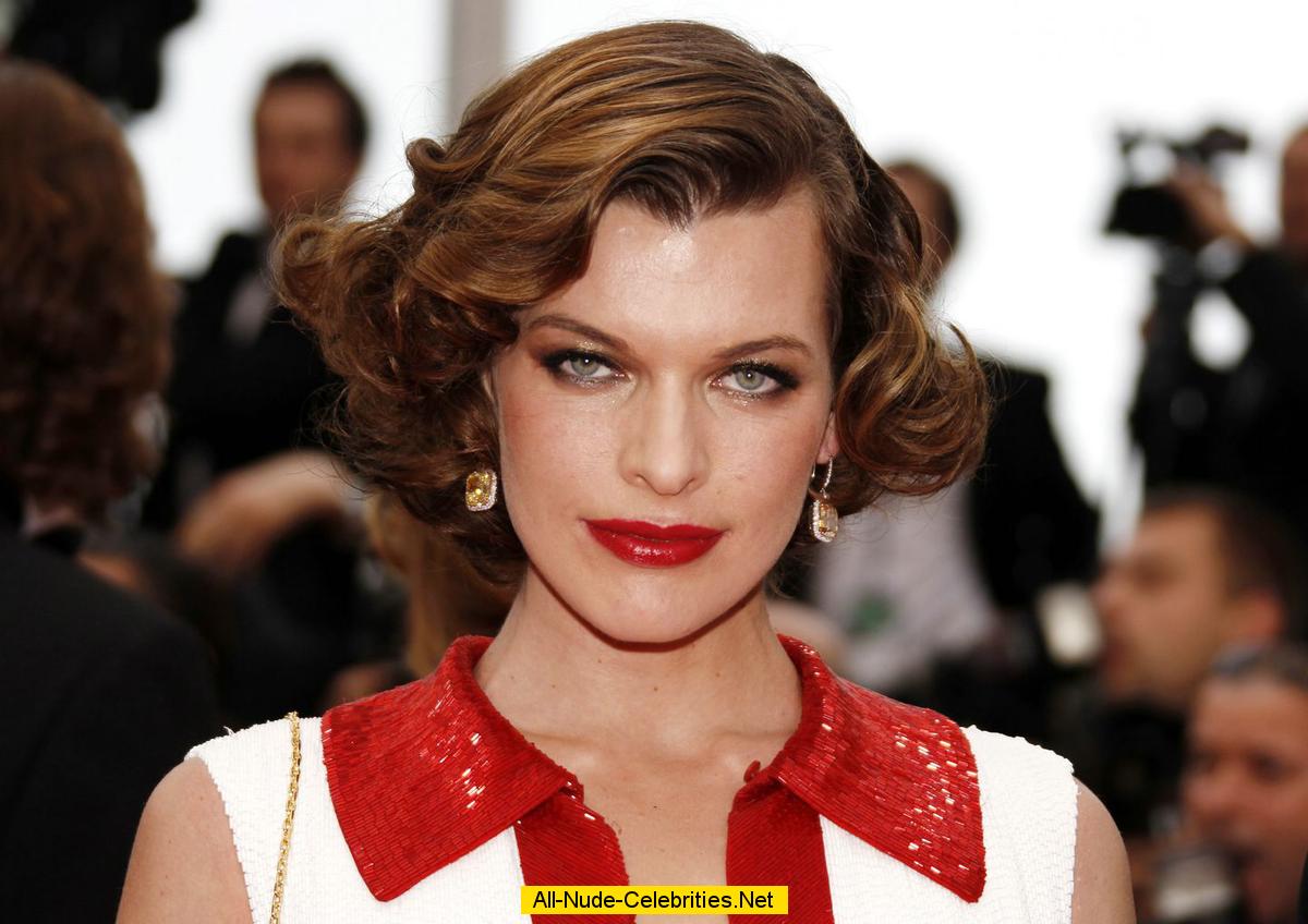 Milla Jovovich posing for paparazzi at Cannes Film Festival 2011